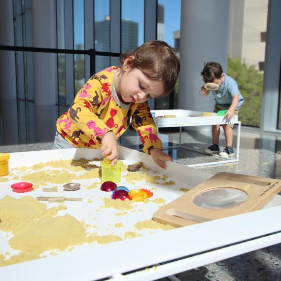 child playing with sand