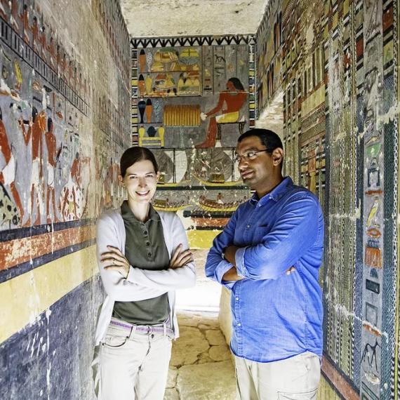 Dr. Mohammed Megahed and Dr. Hana Vymazalova surrounded by hieroglyphics