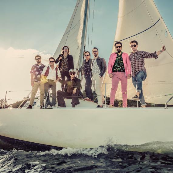 Image of Perth yacht rock band Some Like It Yacht relaxing on board a real yacht.