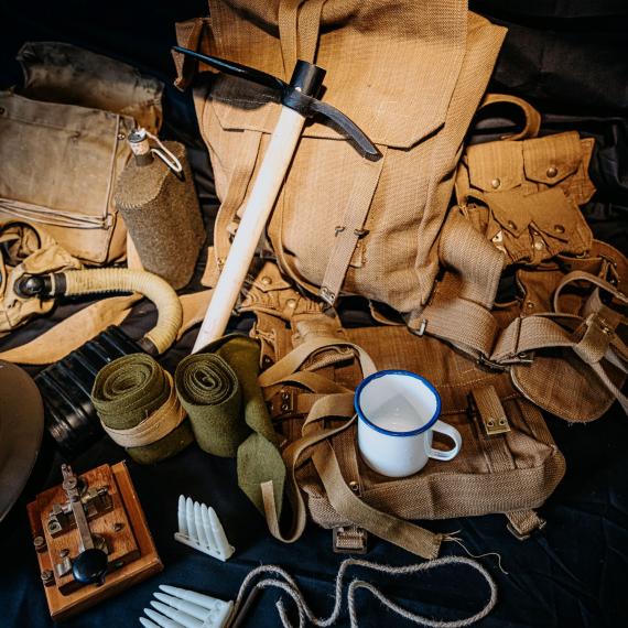 A handling kit featuring cups, backpacks and replicas from the first world war