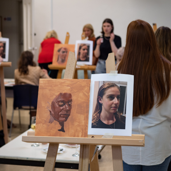 People painting in a workshop