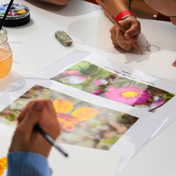 Kids drawing colourful flowers