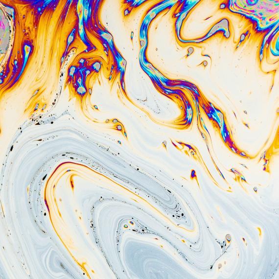 You can see  swirls of different colurs, like blue, red, yellow and orange, blending together to make a swirly pattern