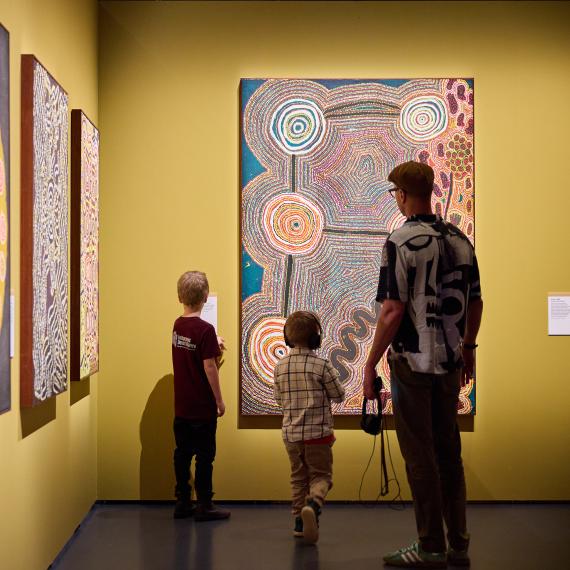 Family walking through an exhibition