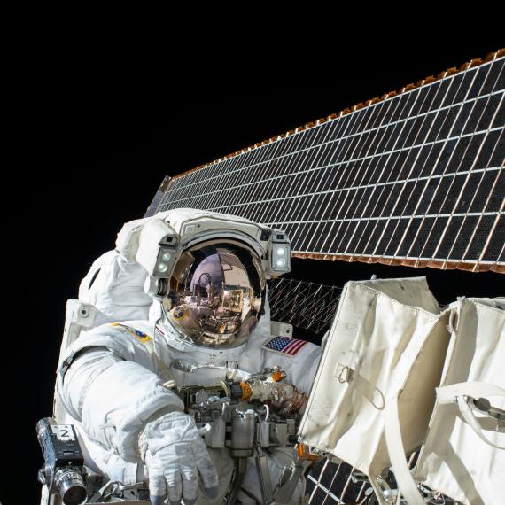 This is an image of a NASA  astronaut on a space walk outside the International Space Station 