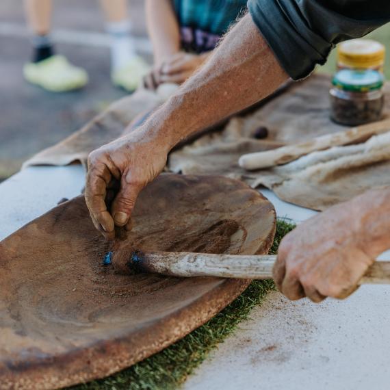 close up of a wooden object being crafted by someone 