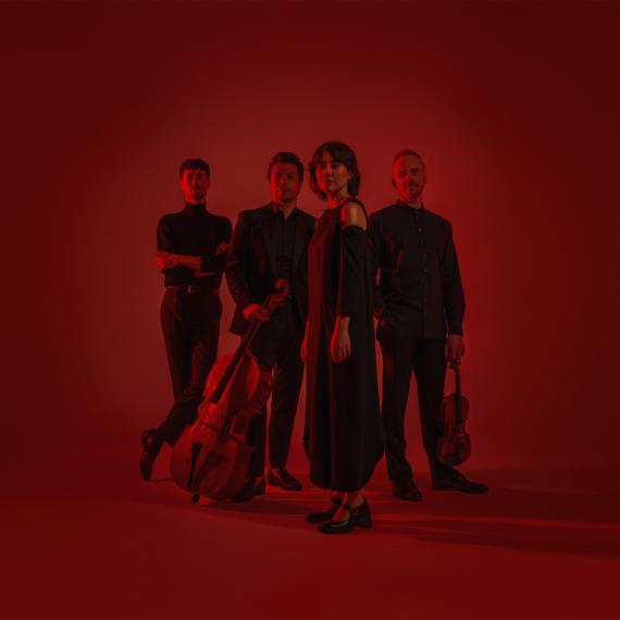 Australian String Quartet for Rapture Concert with moody lighting and red background.