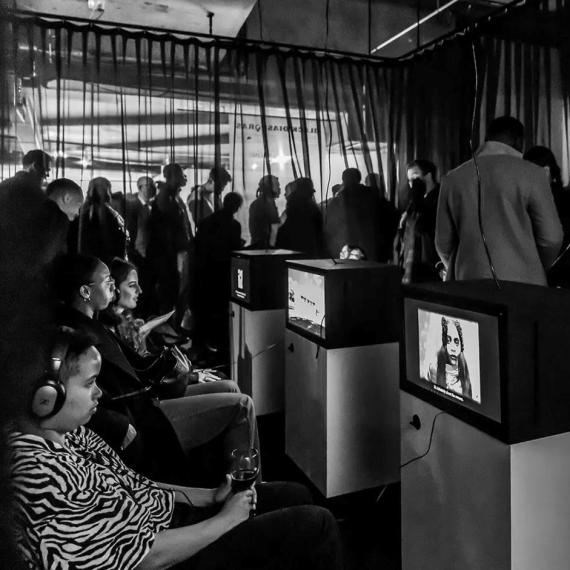 Person watching digital story telling at Black Diasporas Melbourne 