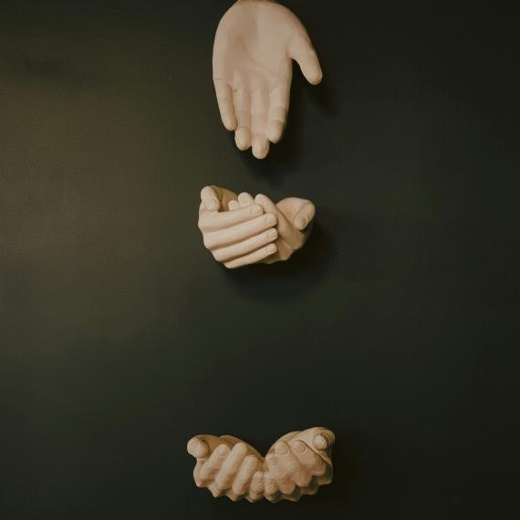 three sets of cast hands arranged in various positions