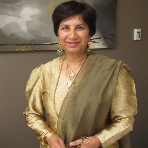 A person wearing a traditional golden outfit 