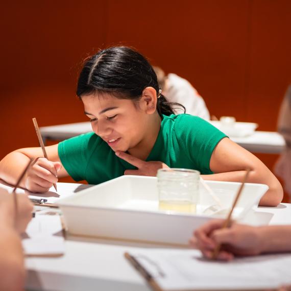 Young girl working at desk 