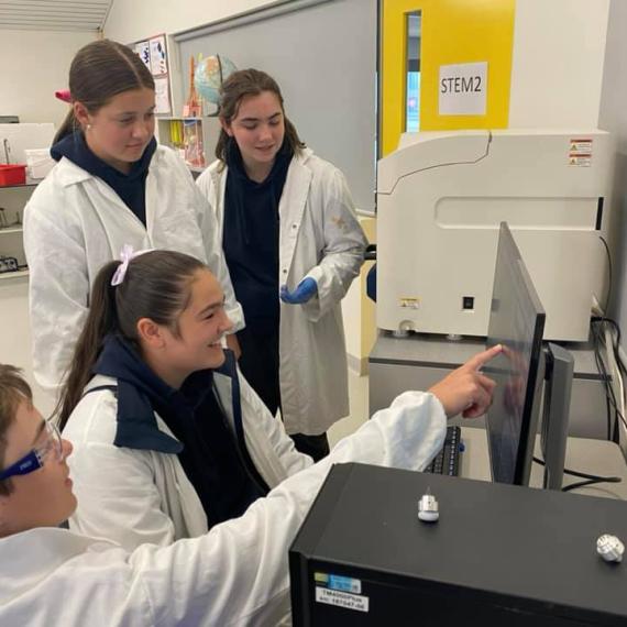 Kids looking at microscopes