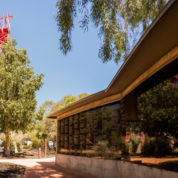 a memorial with names outside amongst a garden