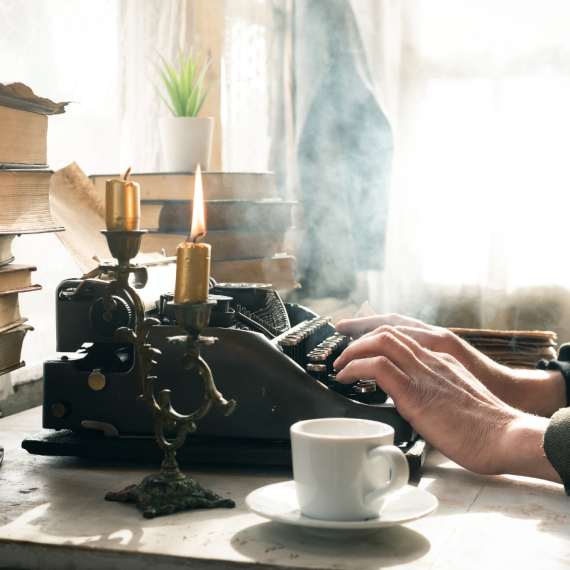 someone typing on a typewriter