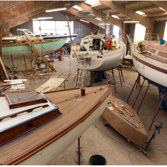 a workshop with sea vessels being restored