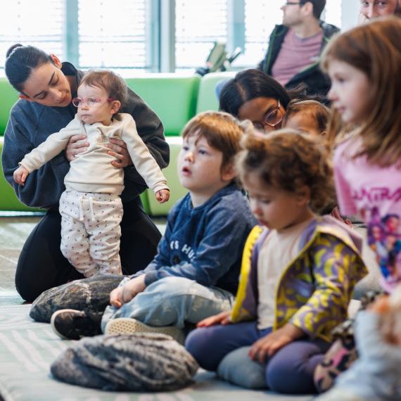 young children listening to stories during storytime discovery session at WAM with their Dad
