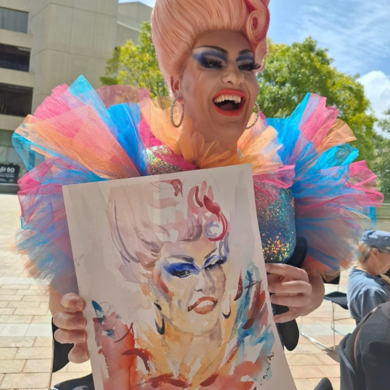 Drag artist holding portrait