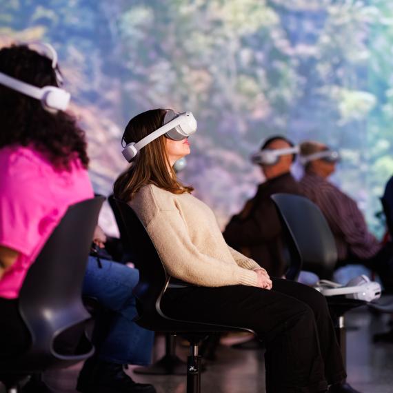 a person wears a virtual reality headset and places it on their head